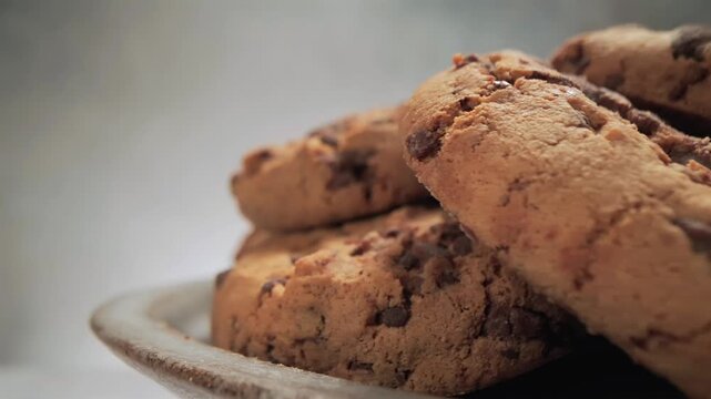 Oatmeal chocolate chip cookies close up with slow moving camera