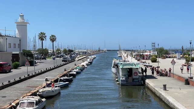 Viareggio harbor and canal with boats, Lucca, Tuscany, Italy. Popular seaside resort and the home of the famous carnival of Viareggio.	