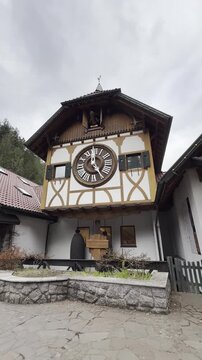 Schonach im Schwarzwald, Germany - April 4, 2026: Video of the World's Largest Cuckoo Clock Striking 5pm With Cuckoo Emerging in the Black Forest