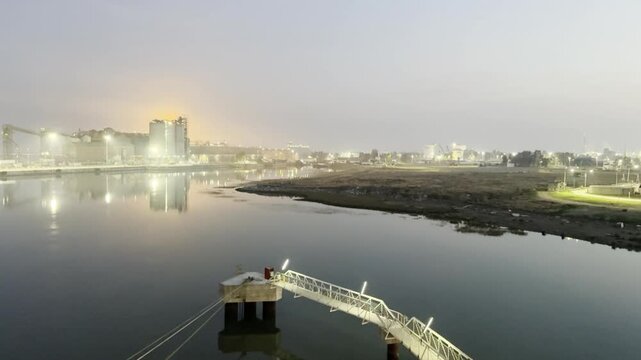 night. lights. industrial zone. fire on tank.