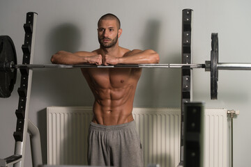 Fototapeta premium Attractive Young Man Resting Relaxed In Gym