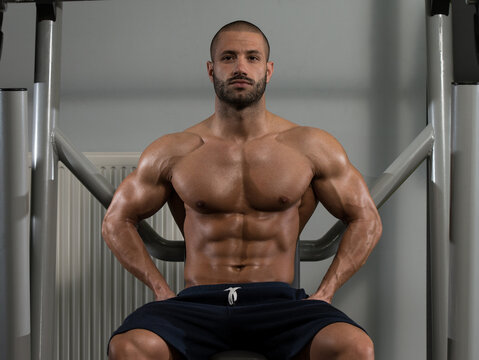Attractive Young Man Resting Relaxed In Gym