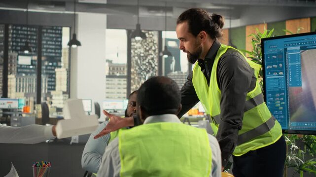 Design colleagues plan a real estate investment in a project meeting area, using property documents and design references to connect development goals with business planning.
