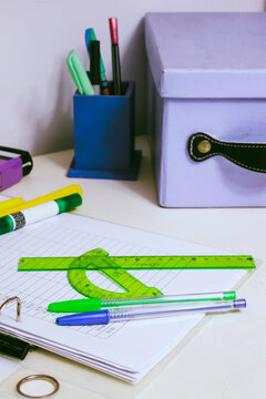 Geometry tools and school supplies for learning and education laid out on an open planner, reflecting themes of studying, preparing, and starting a new academic year
