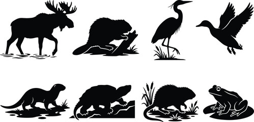 Obraz premium Black silhouette icon set of wetland wildlife animals including a moose, beaver, heron, duck, turtle, and frog.