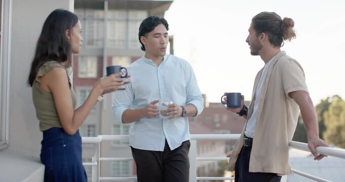 Diverse friends on balcony, center man opening chat, gesturing, holding mugs, catching up