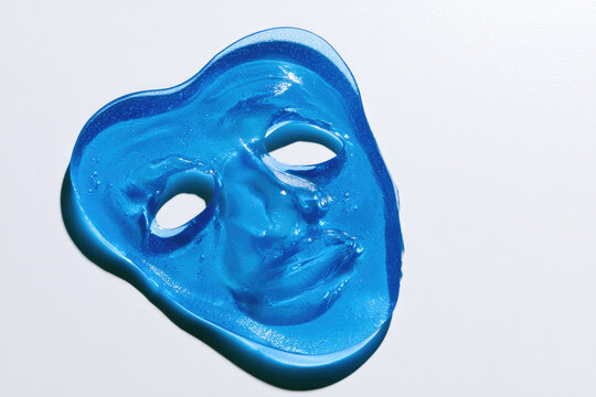Blue cooling gel face mask transparent sheet skin care on white background clean negative space soothing relief cold compress forehead headache stress