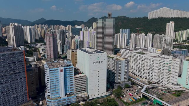 July 11 2026 Tall manufacturing factories line dense urban city streets.
