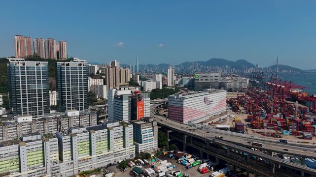 July 11 2026 Tall manufacturing factories line dense urban city streets.