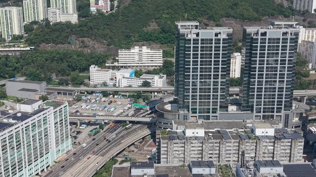 July 11 2026 Tall manufacturing factories line dense urban city streets.