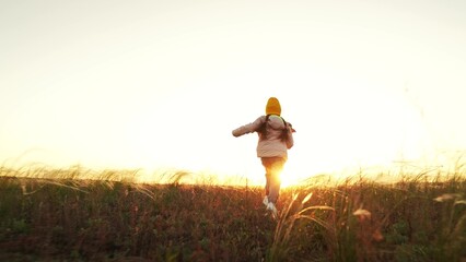 Children dream.little girl runs across field sunset.kid runs towards childhood dream.playground. sunset.girl daughter sunset. children game park airplane pilot.dream becoming airplane pilot.flying © LIVE YOUR DREAM
