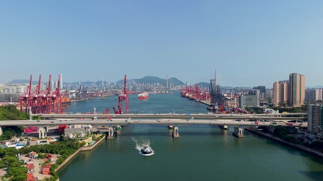 July 11 2026 Cargo vessels navigate busy deepwater shipping container channel.