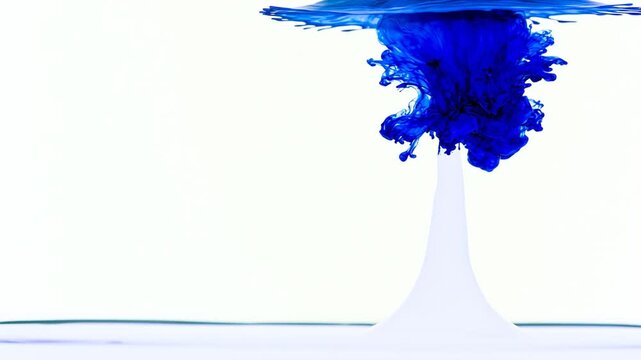 Blue ink drop slowly diffusing in clear water, abstract fluid motion background loop for design