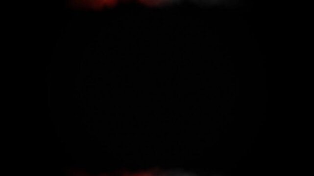 Smooth warm orange and red light leak transition background. Cinematic vintage film burn overlay. Elegant glowing optical flare effect.