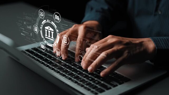 Hands typing on laptop with digital financial icons and banking symbols, representing online banking and financial technology in the modern world. Entropy.