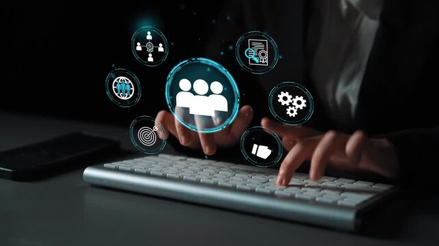 Futuristic User Interface with Icons Representing Business, Communication, and Technology on a Keyboard with Hands Typing in Dark Setting. Entropy.