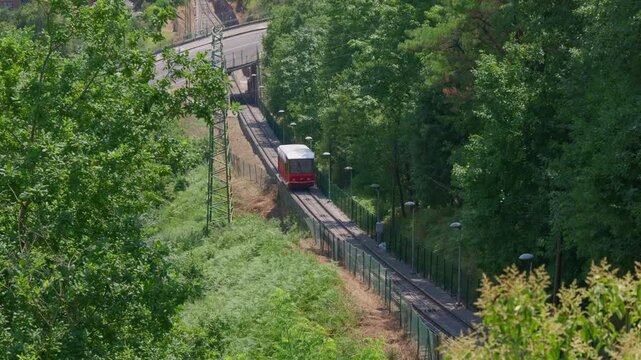 Red funicular railway descending mount artxanda in bilbao
