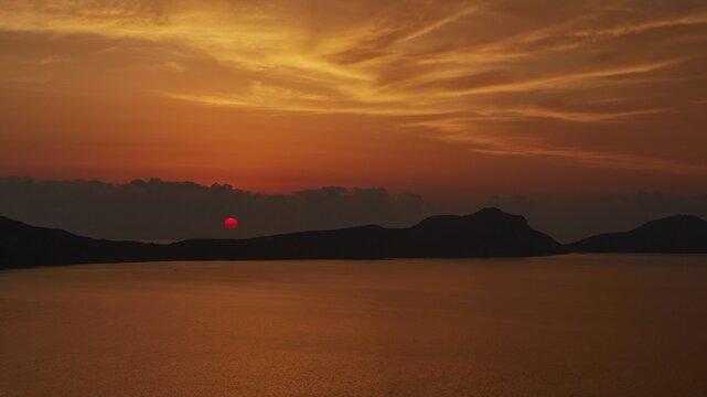 A dramatic red sunset, the landscape appears in backlight, Navarino Bay, Pylos, Peloponnese, Greece