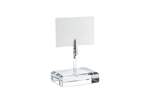 Clear crystal note holder with a metal clip holding a small blank white rectangular card for desk organization and office display isolated on white background