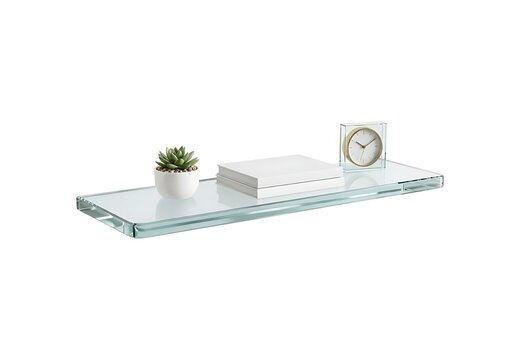 Modern clear glass wall shelf with a small green succulent plant, a stack of white books, and a desk clock isolated on white background