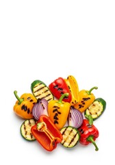 Fototapeta premium Colorful array of flame grilled vegetables featuring bell peppers, zucchini and red onions isolated on white for organic gourmet cooking, vitamins, gourmet, peppers