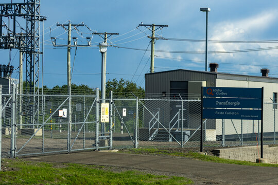 Gaspesie, Canada, 17 June 2026 : Hydro Quebec TransEnergie Carleton substation with power lines and utility poles under a blue sky.