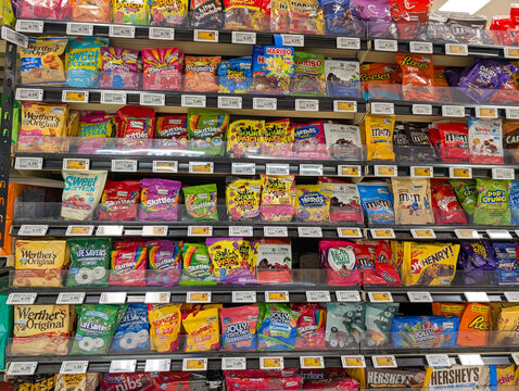 Canada, 21 March 2026 : Werther's Original, Skittles, M&M's, Reese's, and Hershey's candy and chocolate products displayed on supermarket shelves