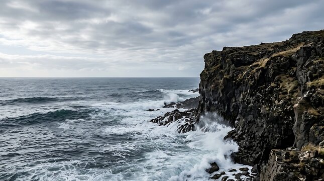 Powerful ocean waves crashing against rugged rocky cliffs