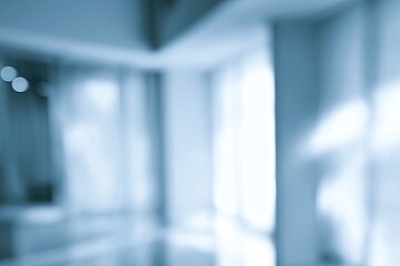 Fototapeta premium Softly lit, blurred interior hallway with bright windows and architectural elements