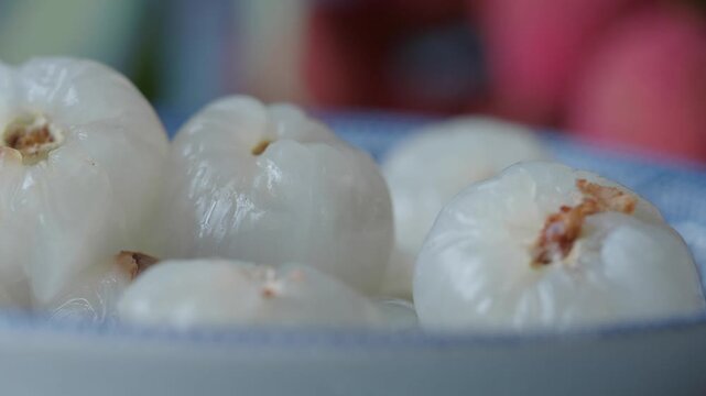 Fresh lychee fruit on a plate in a kitchen