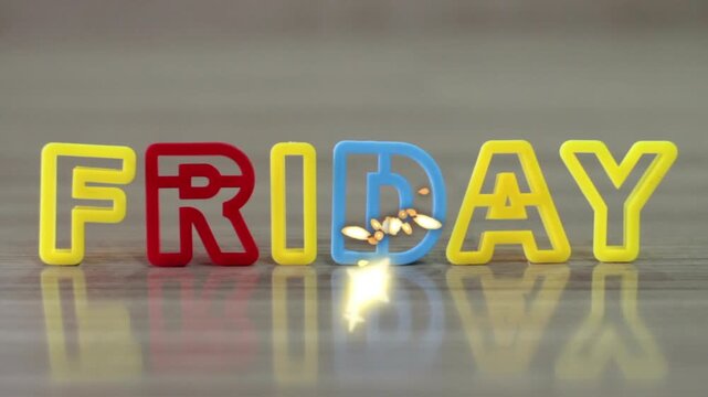 Colorful friday text animation with sparkling effects on gray background