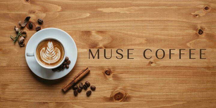 Cup of fresh latte art coffee served with roasted beans and cinnamon sticks on rustic wooden table background for cozy morning beverage lifestyle composition in minimalist cafe setting top view shot.