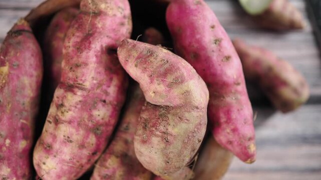 Fresh sweet potatoes in a bowl ready for cooking