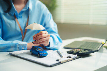 Insurance agent providing comprehensive auto coverage, risk management, financial protection strategies, evolving automotive insurance trends, and securing future mobility © Joi_studio