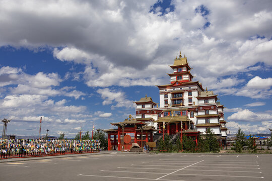 Beautiful majestic Buddhist temple datsan complex against blue sky with dramatic clouds
