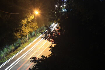 Car light trails on a mountain road at night © 철 김