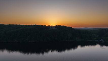 Fototapeta premium Summer aerial view featuring Gillette Castle in East Haddam, Connecticut at sunrise