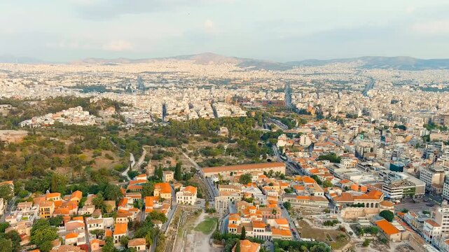 Athens, Greece. Temple of Hephaestus, the best-preserved Doric temple in Greece with its original roof and hexastyle colonnade of Pentelic marble, Drone footage over the Ancient Agora at morning ligh