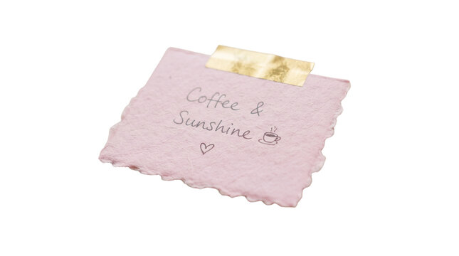 Handwritten pink note with Coffee and Sunshine text, textured paper scrap with gold tape, aesthetic morning reminder on white background
