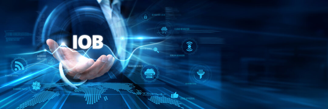 Businessman Hand Hold Internet of Behaviors (IOB) and global user data networking. Digital consumer psychology analysis, behavioral tracking technology, marketing insights