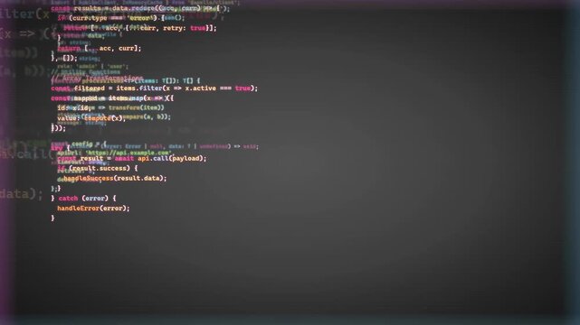 Close up of computer screen displaying scrolling lines of colorful programming code for software development
