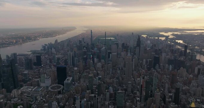 Aerial high angle view of Manhattan tall buildings at sunrise, city skyline panorama of New York City	