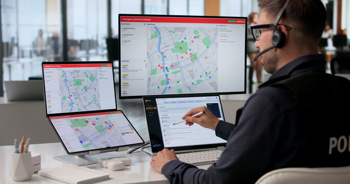 Woman At Busy Emergency Center Quickly Managing 911 Calls With Laptop