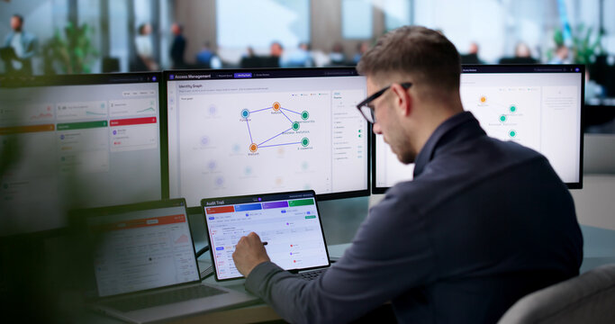 Young IT Manager Monitors User Access Approval Workflow