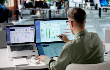 Young IT Manager Reviews Asset Inventory