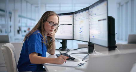 Woman Reviews Healthcare Claims On Computer