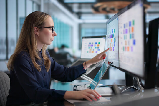 Young Female Field Service Manager Uses Laptop