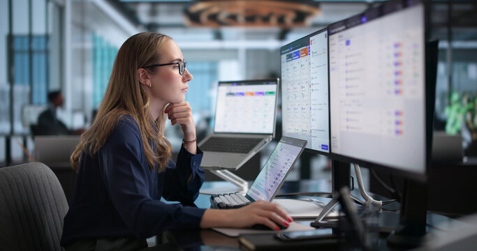 Young Woman Uses Laptop