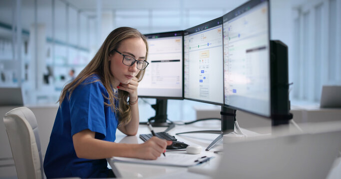 Woman Reviews Healthcare Claims On Computer
