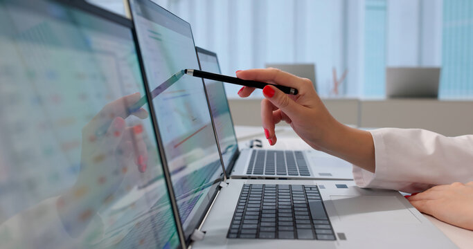 Woman Doctor Reviews Patient Health Data